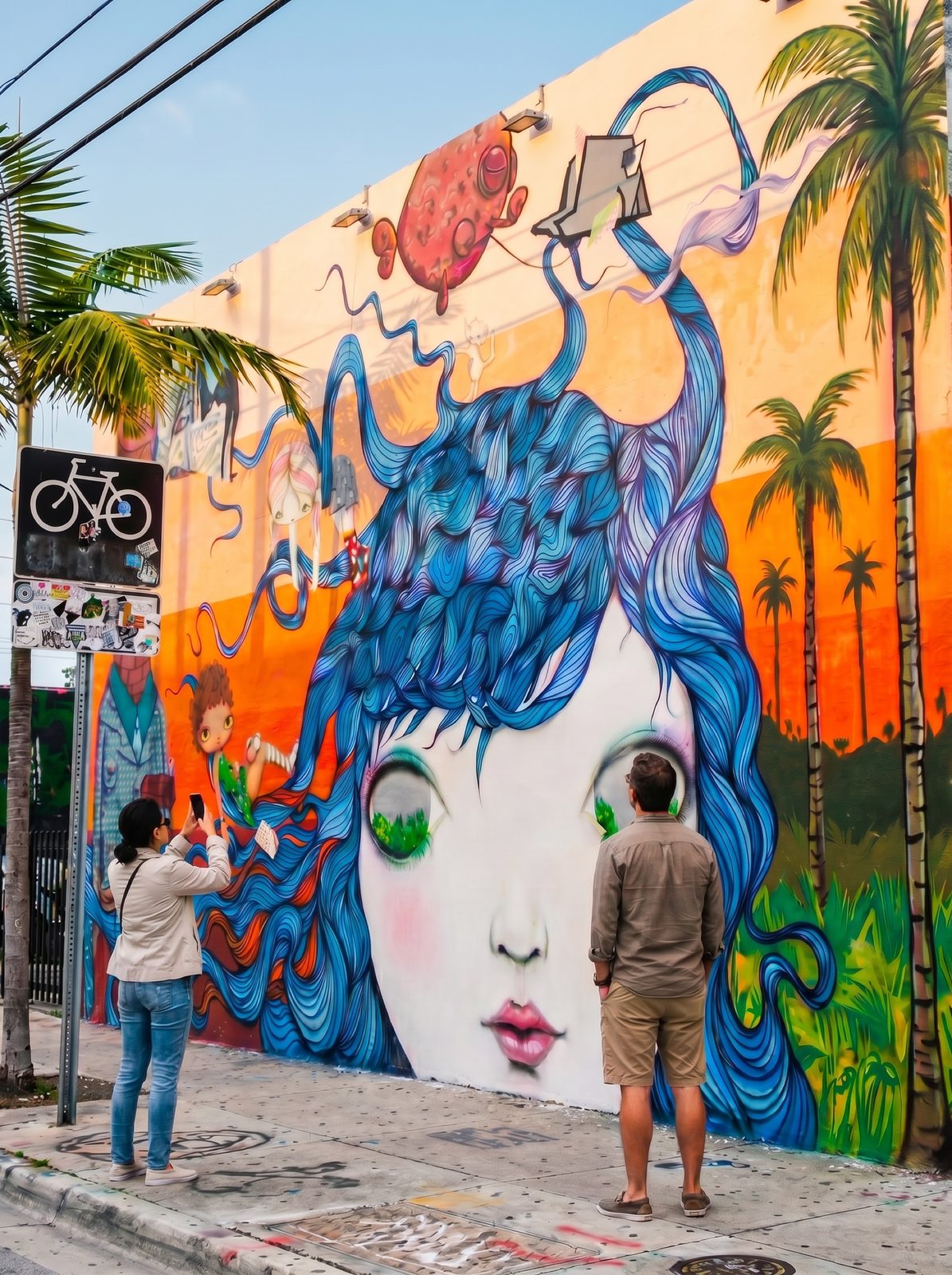 Figurative Wynwood mural of a girl with blue hair